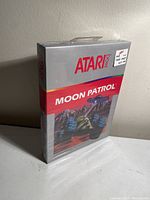 Front side of the Atari 2600 Moon Patrol game box showing the product name and artwork.
