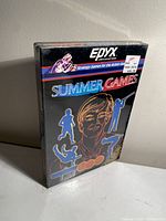 Front and angled views of the brand new box of Summer Games video game for Atari 2600 with original shrink wrap and price stickers.