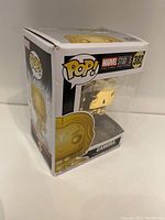 Funko POP! vinyl figure of Gamora in a gold variant inside original packaging showing front and side view.