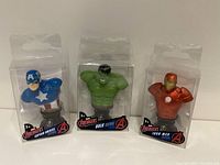 Three new Avengers paperweight busts in packaging: Captain America, Hulk, and Iron Man.