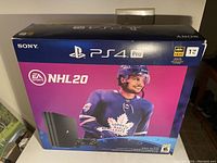 Front of original NHL20 bundle box showing PS4 Pro branding, 1 TB capacity and 4K HDR logos