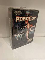 Front view of the NECA Robocop figure box showing branding, artwork, and shrink-wrap seal intact.
