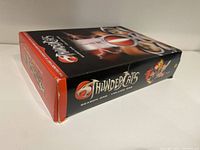 Side view of the Thundercats DVD collector's box showcasing the logo and colorful character artwork on the packaging.