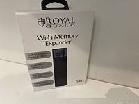 Box front showing Royal Guard Wi-Fi Memory Expander 64GB new in box with features list.