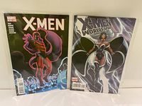 Front cover view of X-Men Issue 13 and X-Men: Worlds Apart Issue 1 comic books laid side by side.