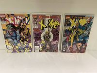 Front cover view of three X-Men comic books in protective sleeves showing the main artwork of issues #270, #271, and #272 featuring characters from X-Tinction Agenda story arc.