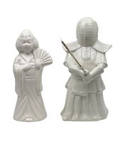 Front view of white ceramic Kendo Samurai mug holding a stick and white ceramic Geisha mug holding a fan