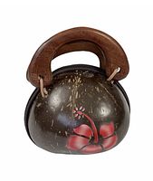 Front view of coconut shell bag showing hand painted red hibiscus flower and double wooden handles