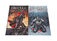 Two comic books with illustrated front covers laid side by side on white surface, titled Dracula: The Company of Monsters. One cover shows Dracula and a man with cape, the other a muscular man in chains with blood drops.