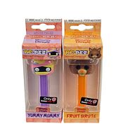 Front view of two boxed Funko Pop PEZ dispensers showing Yummy Mummy and Fruit Brute characters with GameStop exclusive stickers.