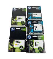 Seven HP printer ink cartridges unopened in original packaging, visible models include 564XL, 564, 74, 920XL, and 61XL.