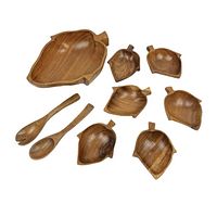 All 9 pieces of the vintage Monkey-Pod Acacia wood salad bowl set arranged together on white background showing leaves and utensils.