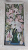 Full view of vertical oil painting depicting light pink and white flowers in dark green vase, framed in white wood frame.