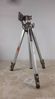 Full view of the Velbon VG-3 tripod fully extended showing aluminum legs and panhead.