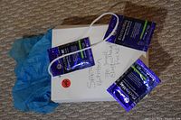 Photo showing several blue and black Electromag magnesium electrolyte drink packets and a white box labeled 'Spartan Nutrition 70 Electromag Packs'.