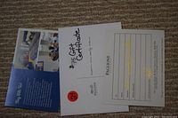 Photo of the $75 gift certificate from Paglione Winery with accompanying informational brochures.