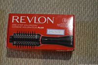 Original box of Revlon One-Step Volumizer Plus showing image and branding.