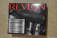 Photo of box for the Revlon Perfect Heat Lightweight Fast Styler hair dryer showing product branding, features, and power specifications.