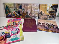 Photo showing six Rip Squeak themed storybooks along with a purple Craftabelle notebook and a Fortune Teller art and craft kit.