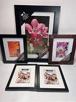 Front view of all 5 brand new frames with sample images inside.