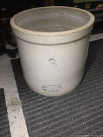 Front side view of the Medalta 3 gallon stoneware crock showing the blue number 3 and the Medalta oval stamp.
