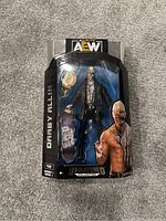 Front view of Darby Allin AEW action figure packaging showing figure with accessories inside plastic window box.