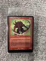 Front view of a Magic: The Gathering card 'Ridgeline Rager' depicting a red creature, cost mana and creature stats.