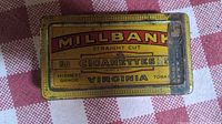 Top view of Millbank cigarette tin label showing brand name, quantity of cigarettes, and tobacco grade.