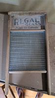 Washboard front view showing wooden frame, glass washing surface, and Regal Glass Made in Canada branding.