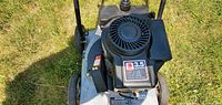 Top and side view of Craftsman 3.5HP gas lawn vacuum blower chipper motor and frame on grass.