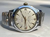 Front view showing dial with Brock branding, 17 Jewels, Waterproof, Incabloc, and gold-tone numerals and hands including red-tipped second hand.