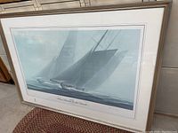 Frontal view of the framed sailboat print showing the full composition and frame.