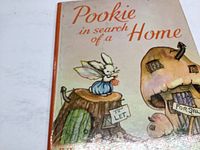 Front cover of the book showing the title and illustrated bunny character with mushroom house.
