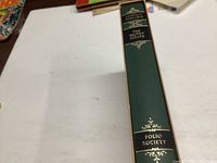 Green slipcase with gold decoration and 'Folio Society' text.