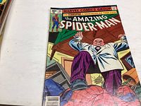 Front cover of The Amazing Spider-Man comic issue 197 showing Spider-Man and a man in white suit.
