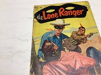 Front cover showing the Lone Ranger and Tonto with guns drawn in a dramatic pose.