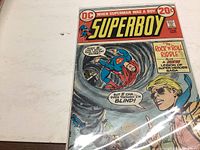 Front cover of Superboy #195 comic book sealed in plastic, showing artwork of Superboy and a blind man with text from the story and titles including 'The Rock 'n' Roll Riddle'.