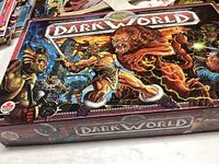 Box top with colorful fantasy artwork of warriors and creatures and game title Dark World by Canada Games.