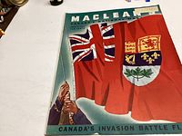 Front cover of the Macleans magazine July 1, 1944, showing a hand raising the Canadian invasion battle flag with a Union Jack background and Canadian shield.