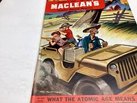 Front cover close-up showing colorful illustration of a man driving a jeep with two children, with the magazine title and date.