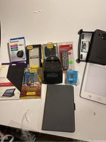 Full lot overview showing all items including packaging and electronic devices