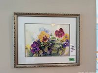 Full view of the framed watercolor print of pansies with label indicating it is an 11x15 print.