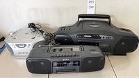 Three radios including TruTech T200-B, Sony CFS-200 cassette radio, and GPX dual cassette/CD player boombox.