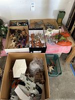 Overview of assorted loose items in cardboard boxes