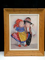Full view of framed painting showing two Kathe Kruse dolls in traditional costume, wooden frame visible