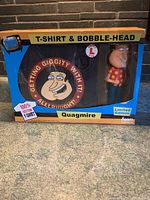 Image of original boxed Family Guy T-shirt and bobble-head set featuring Quagmire character.