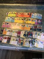 Full spread of Pokémon Darkness Ablaze cards laid out in rows showing the majority of the lot including holo and non-holo cards.