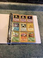 One page of binder shows 9 original vintage Pokémon cards including Alakazam, Gengar, and Pikachu, some holographic.