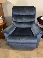 Front view of blue Franklin Ulti massage rocker recliner, showing plush cushioned backrest and armrests.