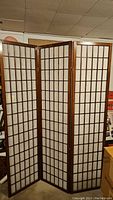 Front view of 3-panel Shoji screen with wooden lattice frame and white translucent paper panels.